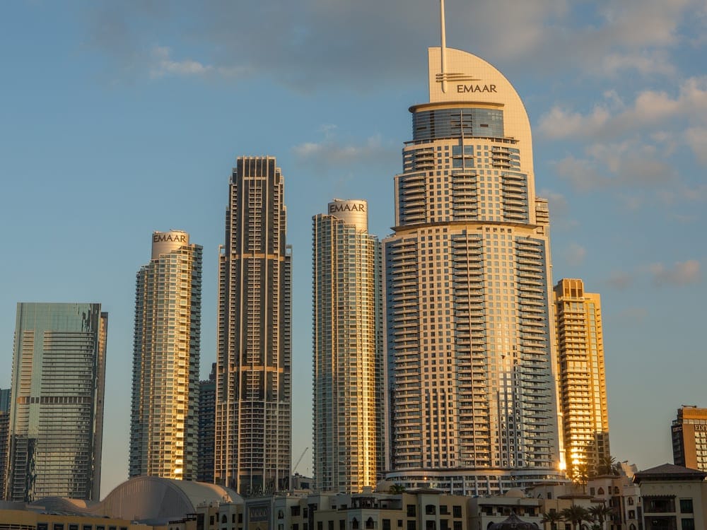 Downtown Dubai towers lit by the setting sun